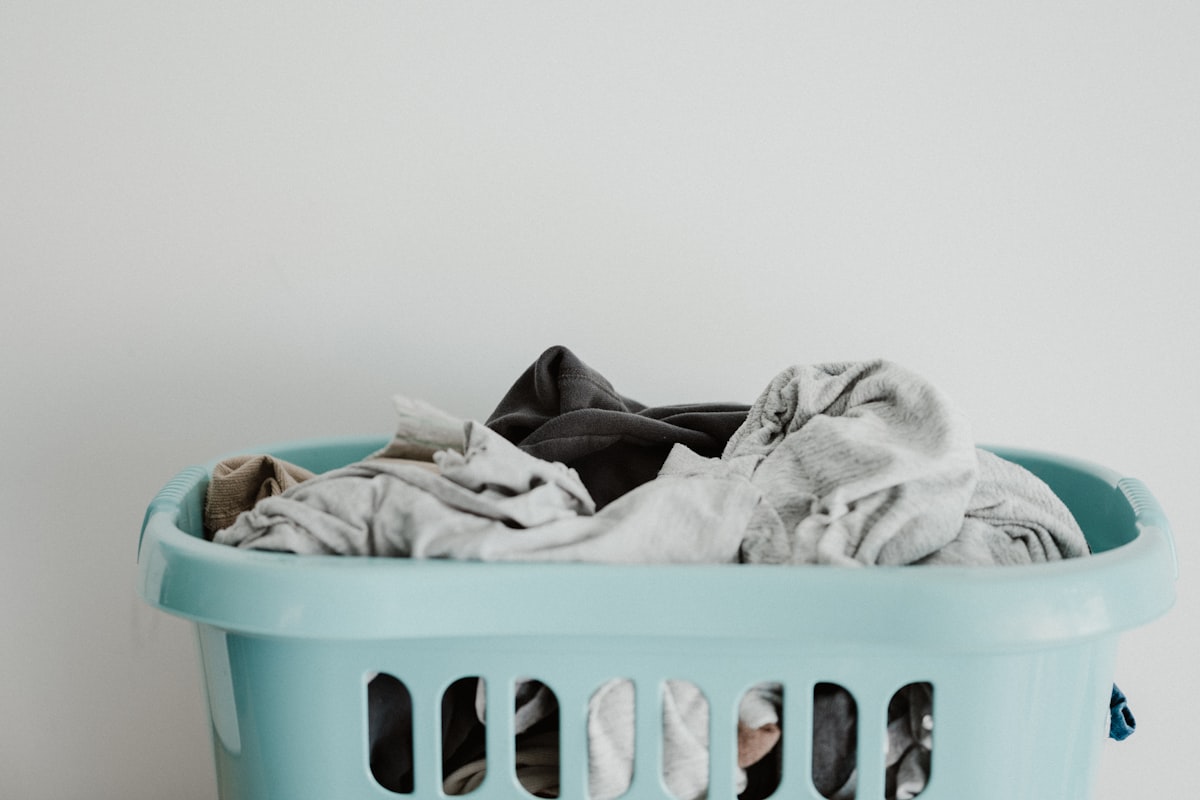 A basket brimming with the everyday wash we collect, clean, and return folded